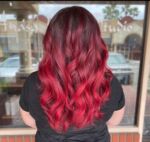 Unleash your inner fire with Lindsay's vivid balayage!  Get ready to rock this stunning red hair and make a statement wherever you go! Visit our salon and let us work our magic on your locks! #RedHot #BalayageBeauty #HairEnvy #temeculasalon #temeculahair #anasahairstudio