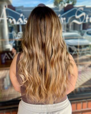 Let your hair do the talking! Our stylist Lindsay worked wonders on this guest's long, wavy locks with her incredible balayage & shadow root color skills. Get ready to turn heads wherever you go! #HairGameStrong #BalayageBeauty #temeculasalon #temeculahair #anasahairstudio