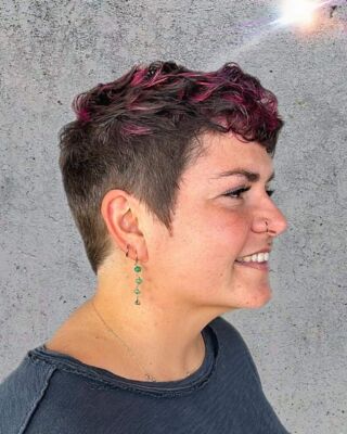 Ready to embrace your inner Rockstar? This pixie haircut with  Magenta vivid highlights is the ultimate way to express your individuality! Tanya is a master of creating unique looks like this. Step into our salon and let us unleash your true style!  #EmbraceYourRockstar #Pixiehaircut#HairSalonMasters #temeculasalon #temeculahair #anasahairstudio