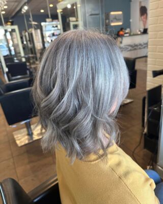 Elevate your hair game with Anasa Hair Studio! Our stylist Nadine has created this stunning smoky silver highlight on our lovely guest. #AnasaHairStudio #HairGameStrong #temeculasalon #temeculahair