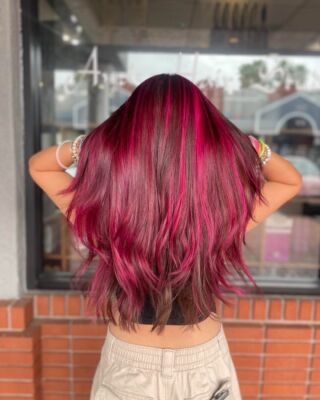 Dare to be Different! Jenna has created a masterpiece with these high contrast pink highlights. Step out of your comfort zone and let your hair shine with a touch of pink magic! Swipe for before. #DareToBeDifferent #PinkMagic #SalonArtistry #temeculasalon #temeculahair #anasahairstudio